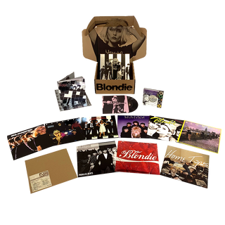 Collection of Blondie music memorabilia including vinyl records, photos, and a box set on a white background.