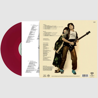 A vinyl record album shown open to the back cover, with a dark red vinyl disc partially visible on the left and the printed back cover on the right. The cover features a photo of a man holding a guitar and a woman in a green patterned dress, on a light cream background.