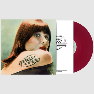 A vinyl record partially pulled from its sleeve, showing a portrait of a woman with a tattoo on her shoulder and a maroon red vinyl disc visible on the right against a light gray background.