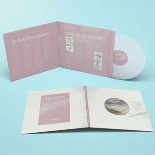 Vinyl record album shown open in two views on a light blue background. The album cover and inner pages are pale pink and white with printed text and a circular multicolor artwork insert.