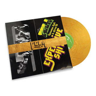 A vinyl record partially slid out of its sleeve, shown on a clean white background. The record is translucent gold, and the sleeve features black, yellow, green, and purple graphics with the text 'FELA' and 'Experience 2010'.