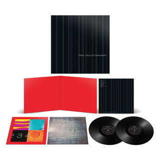 A double vinyl record package for Ryuichi Sakamoto's 1994 album 'A Small Miracle', displayed on a white background. The set includes a black striped outer sleeve, a bright red inner slipcase, two black vinyl records, a colorful printed insert, and a sheet of sheet music.
