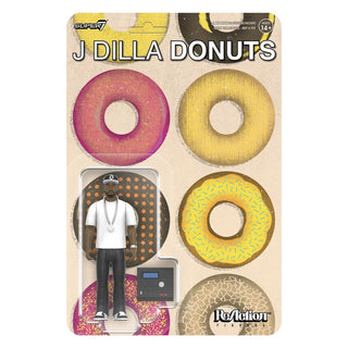 J Dilla 'Donuts' ReAction Figure by Super7, packaged on a retro-style cardboard backing featuring illustrated donuts and the text 'J DILLA DONUTS'.