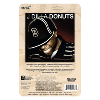 J Dilla 'Donuts' album cover art packaging insert by Super7, featuring the artist's name in bold white text over a black-and-white photo of J Dilla wearing a cap, on a beige textured card with track listing details and barcode.