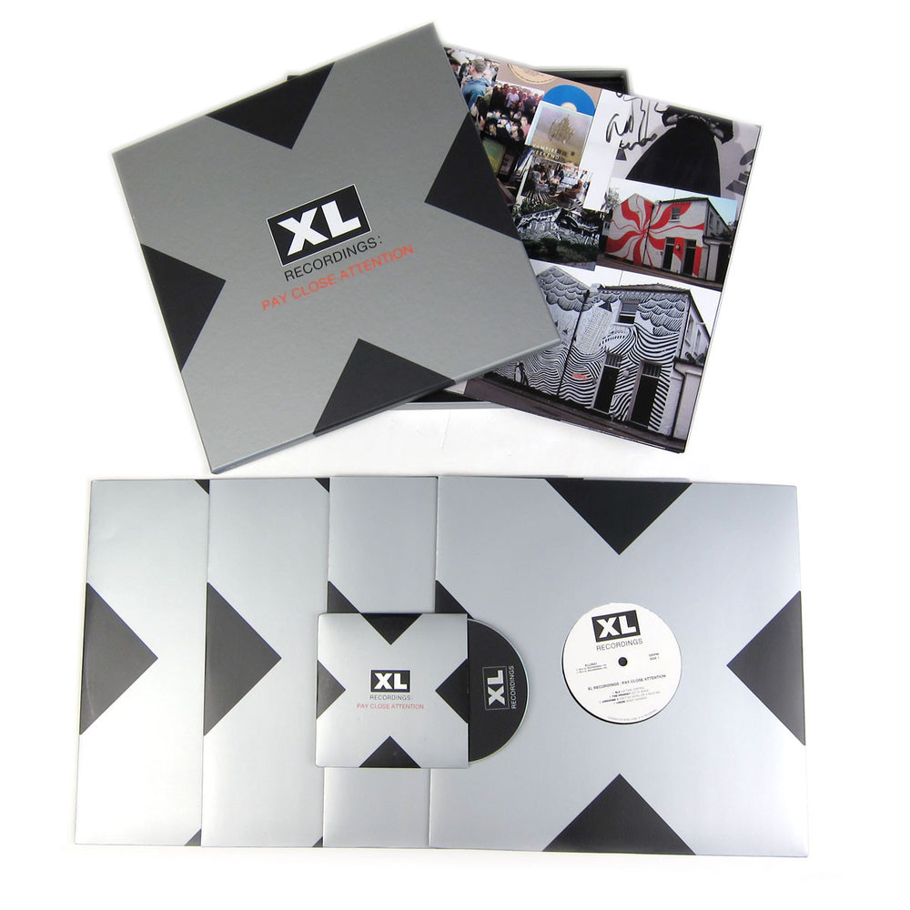 XL Recordings: Pay Close Attention Vinyl 4LP Boxset laydown